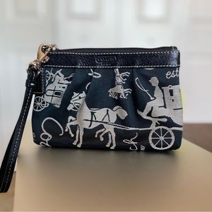 Never used / brand new - Coach wristlet with horse carriage pattern on fabric